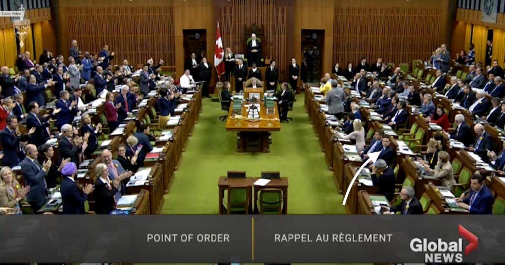 The Conservative Party website showing about 23 Canadian Flags and about 37 maple leaf emblems. (April 21, 225) From Global News, arrow mine